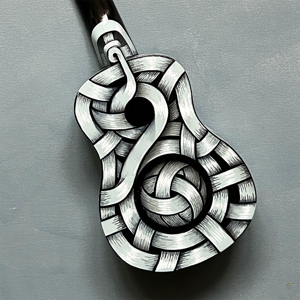 An Otto Schade AKA Osch unique artwork, a black and white ribboned ukelele
