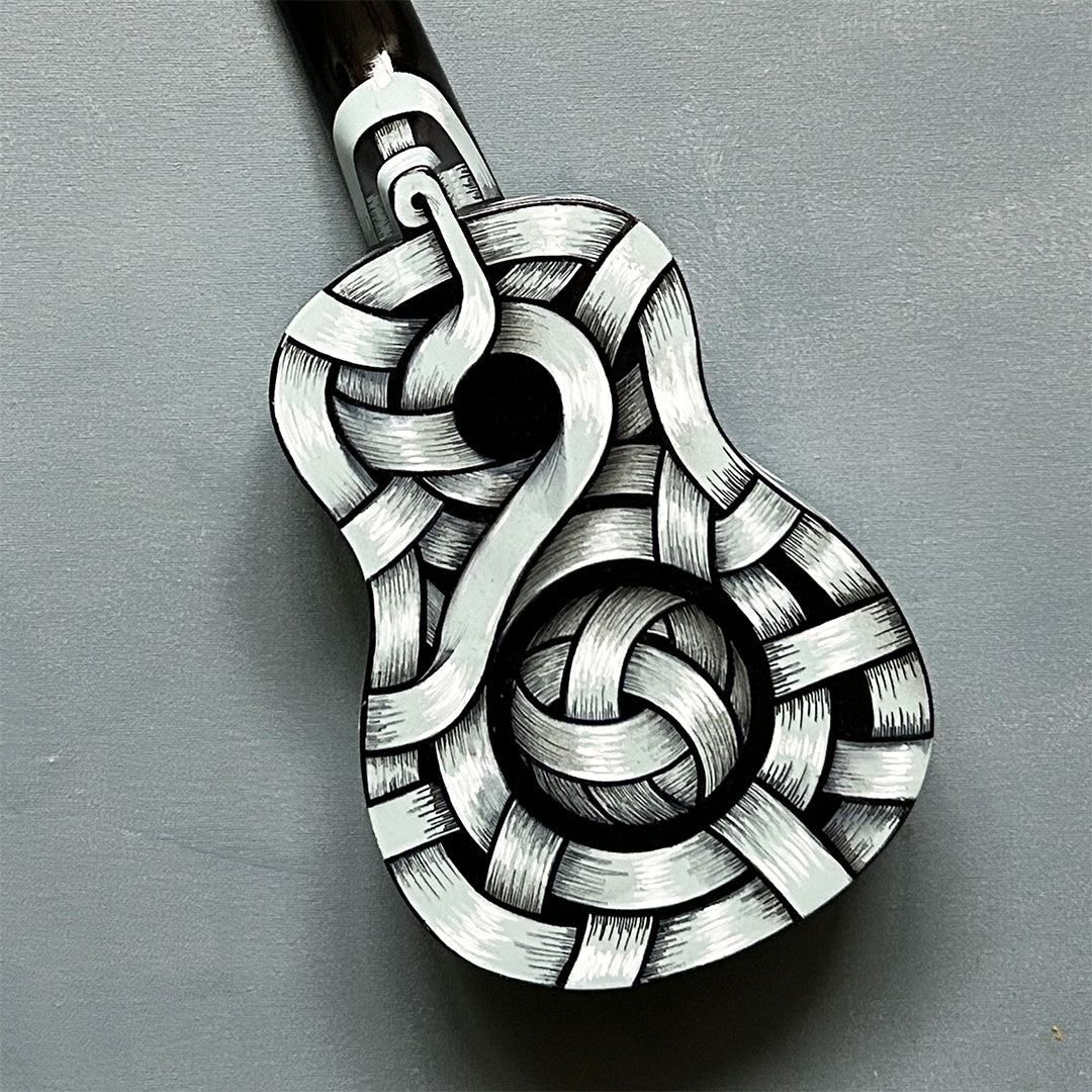 An Otto Schade AKA Osch unique artwork, a black and white ribboned ukelele