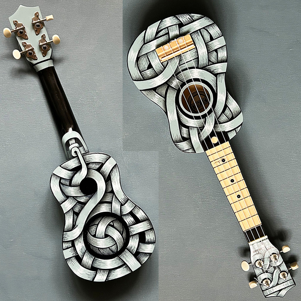 An Otto Schade AKA Osch unique artwork, a black and white ribboned ukelele