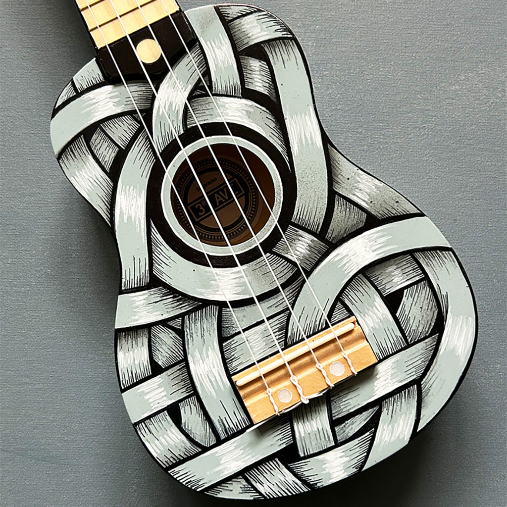 An Otto Schade AKA Osch unique artwork, a black and white ribboned ukelele