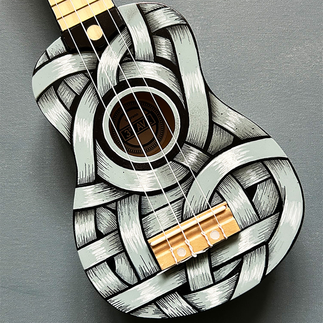 An Otto Schade AKA Osch unique artwork, a black and white ribboned ukelele